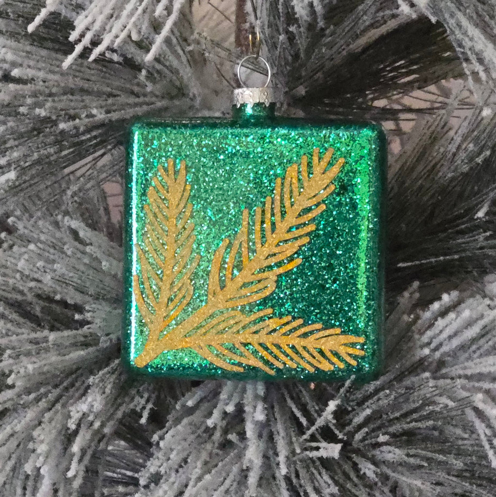 Decorative ornament with green and gold leaf design