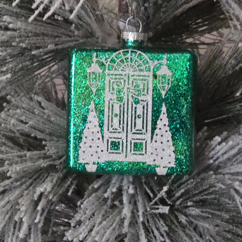 Green glittery ornament with a front door design 