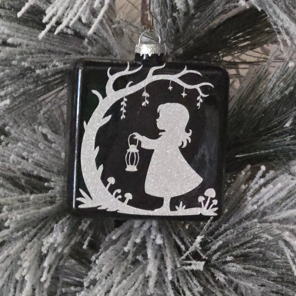 Decorative ornament with girl and lantern in silver  on  black 